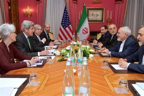 U.S. and Iranian delegates in a tense diplomatic meeting with both national flags displayed behind them “U.S. and Iranian officials seated at a negotiation table with the American and Iranian flags behind them, symbolizing stalled diplomatic talks and rising geopolitical tension