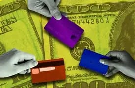 Three hands holding purple, red, and blue credit cards against the background of a large U.S. hundred‑dollar bill, representing credit card debt and the rising financial burden on Americans